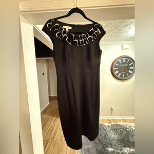 Elegant Black Dress with Textured Neckline Detail